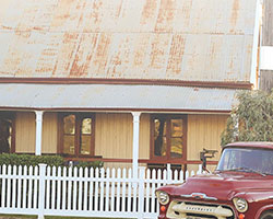 a red car in front of a house