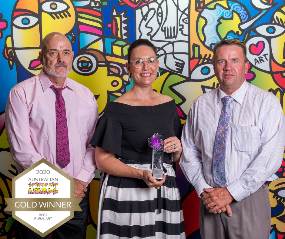 David Cooper, Terri-Anne Crothers and Will Officer holding the Best Rural Artwork awarded to the Yelarbon Silos