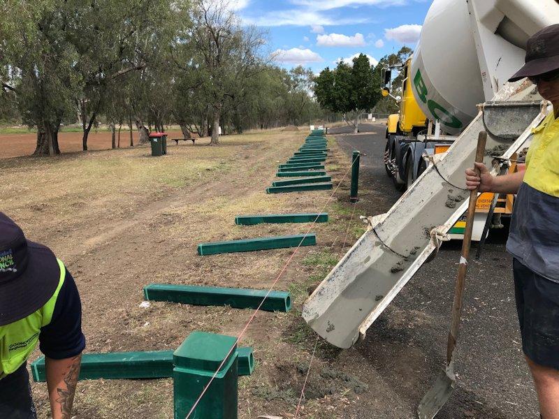 workers replacing bollards at three popular Goondiwindi parks for improved safety